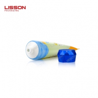 Crema de protección solar tubo de compresión con tapa superior abatible