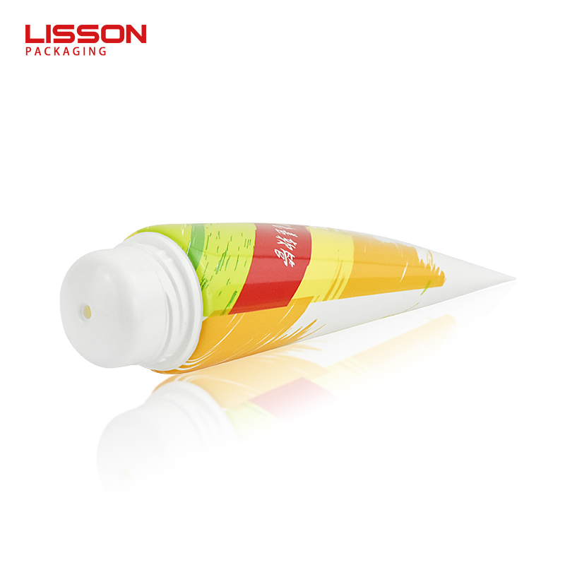 Crema depilatoria con tapón de doble color en tubo