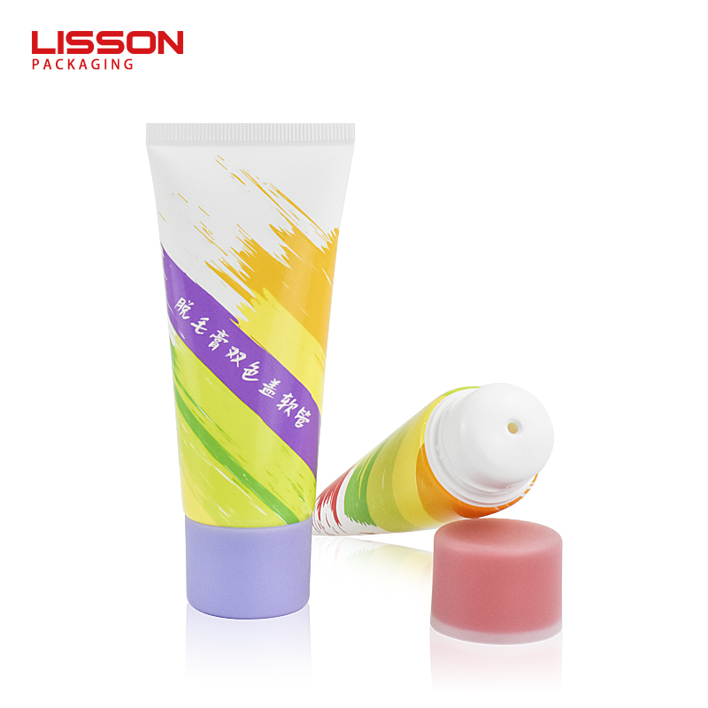 Crema depilatoria con tapón de doble color en tubo